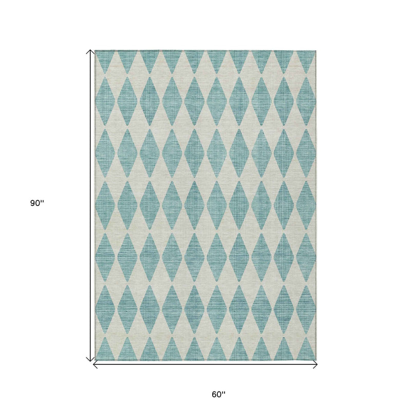5' X 8' Teal Blue And Ivory Geometric Washable Indoor Outdoor Area Rug