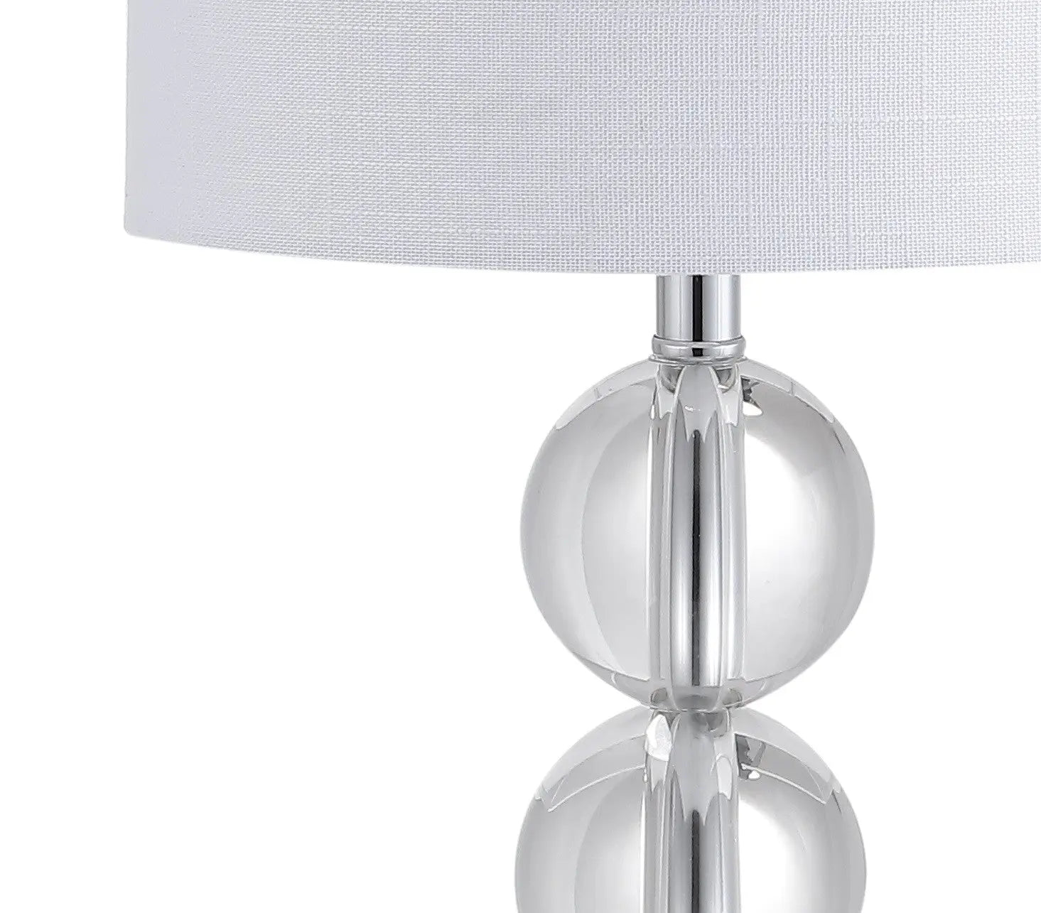 Clear glass table lamp with a sleek chrome base and a white linen shade, perfect for modern decor.