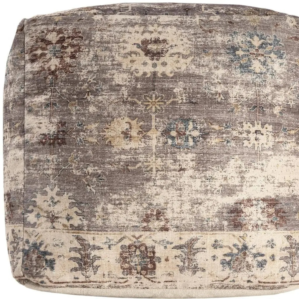 Vintage-style pouf in beige, gray, and blue floral patterns, crafted from soft, durable fabric for chic home decor.