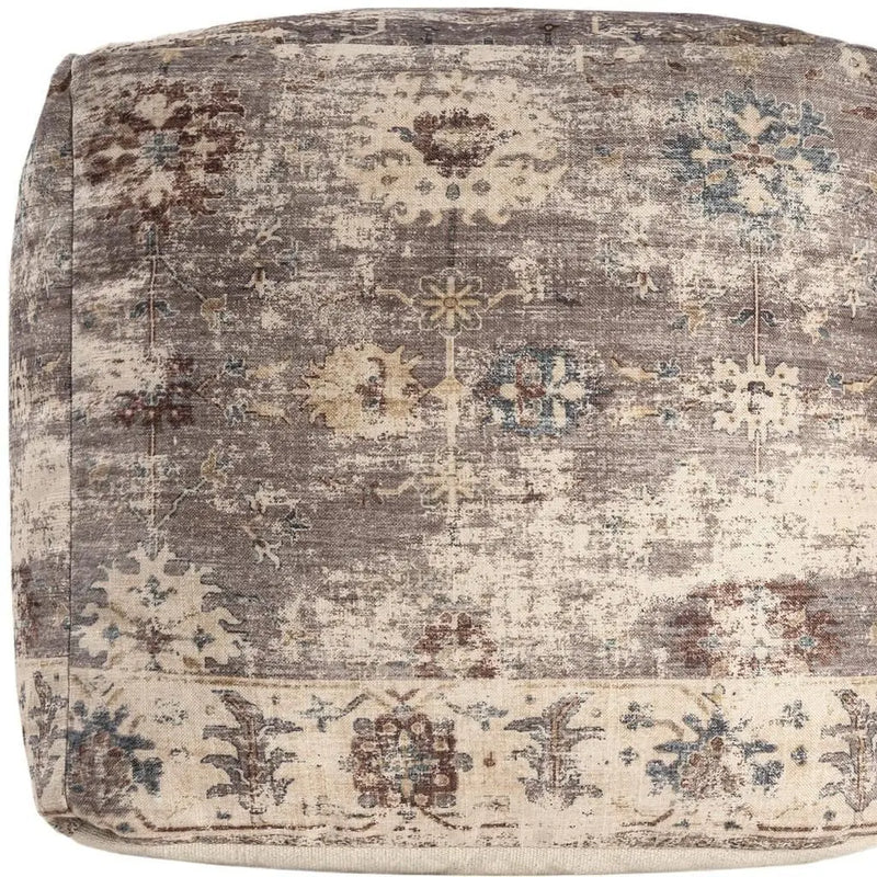 Vintage-style pouf in beige, gray, and blue floral patterns, crafted from soft, durable fabric for chic home decor.