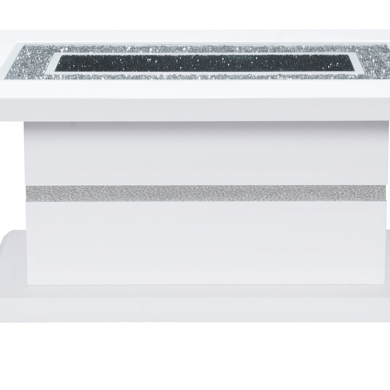 Close-up of white pedestal coffee table with faux crystal inset and gray trim