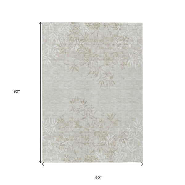 5' X 8' Beige Tan And Ivory Floral Washable Indoor Outdoor Area Rug