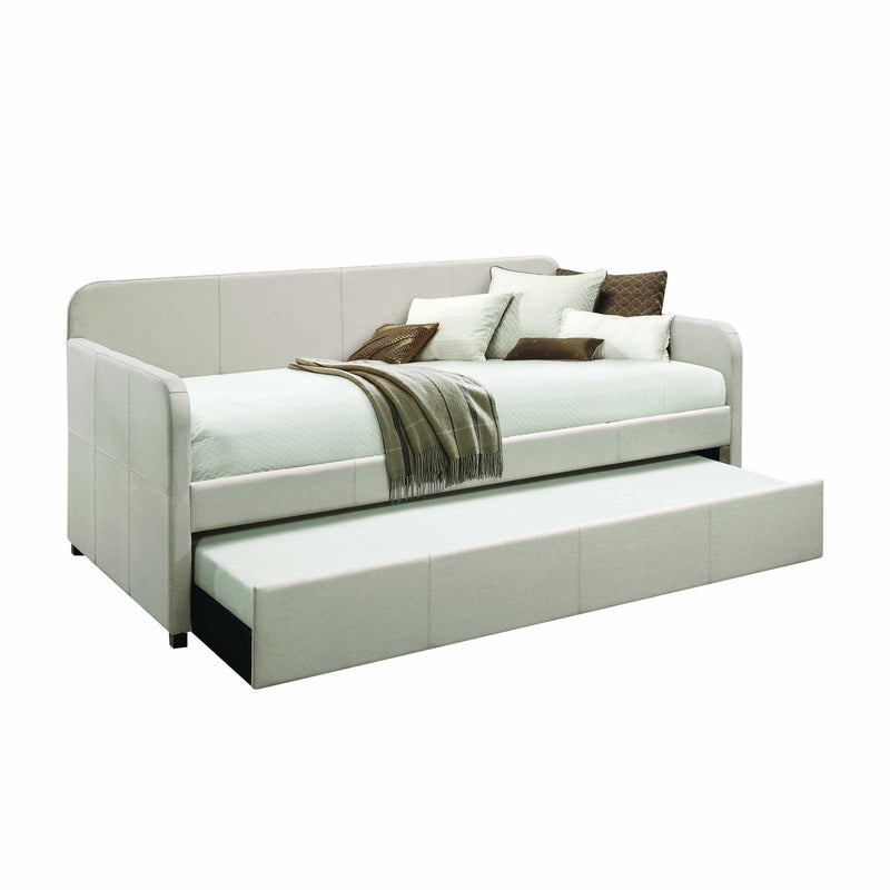 Light gray upholstered twin bed frame with square armrests and open bed platform