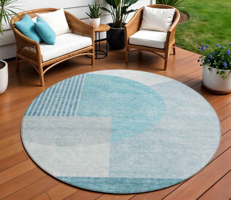 8' Teal Blue And Silver Round Geometric Washable Indoor Outdoor Area Rug