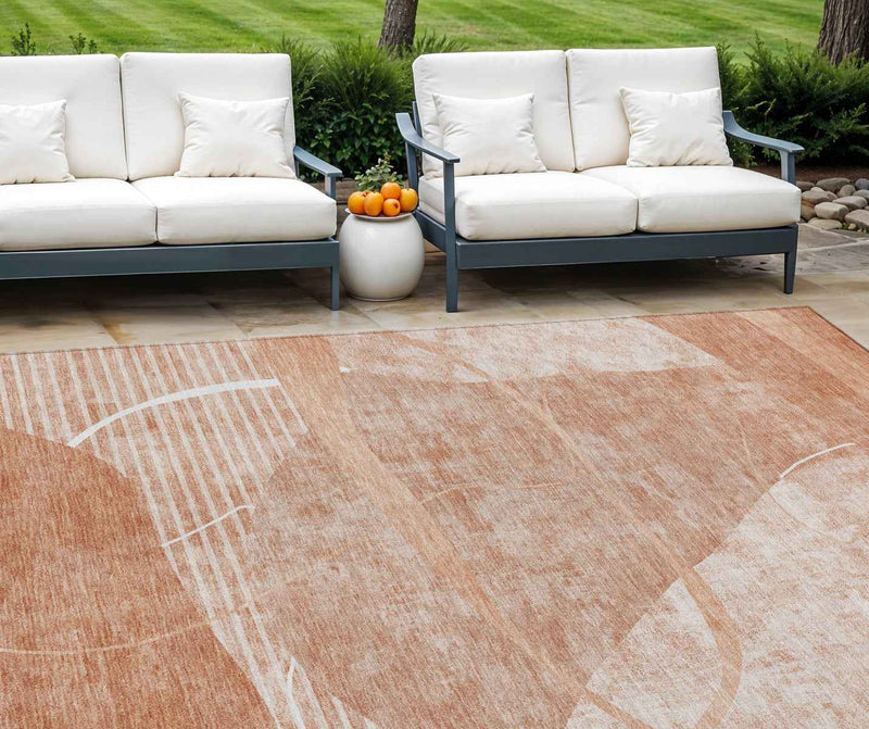 8' X 10' Salmon Copper And Ivory Abstract Washable Indoor Outdoor Area Rug