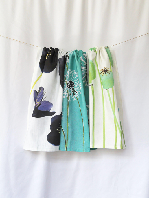 Tea towel with teal panels and white floral and leaf motifs