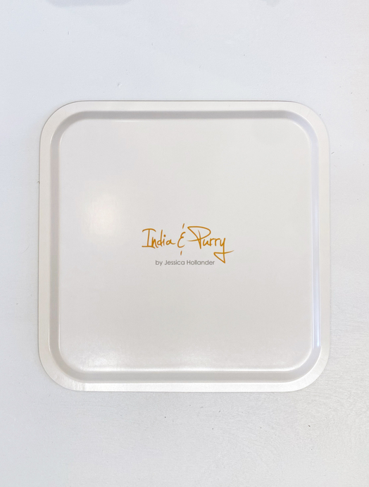 Square light-cream serving tray with raised border and centered orange logo