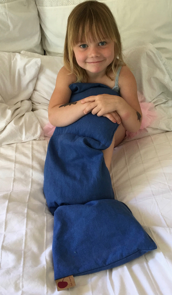 Blue denim triple square pillow with small red cherry patch