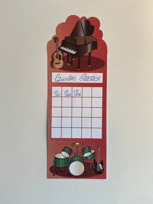 Personal incentive chart with guitar practice scene and red writing grid sections