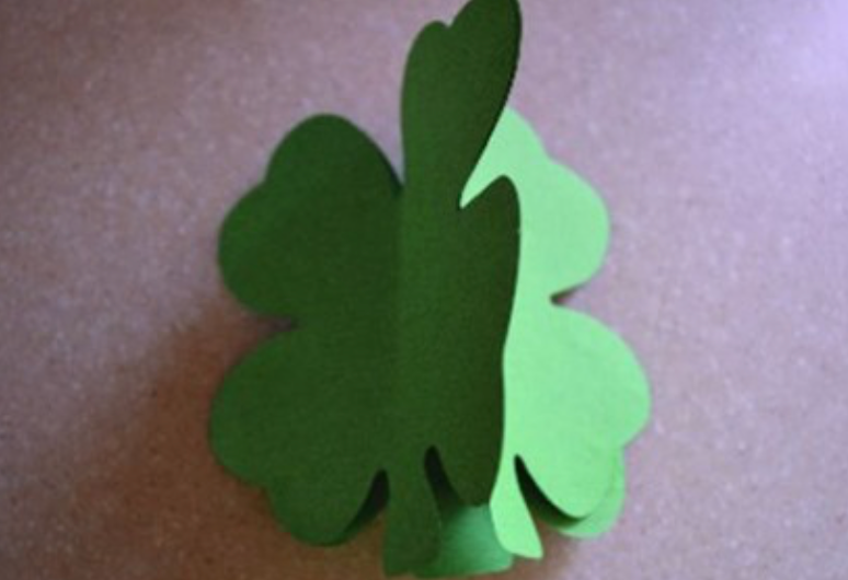Green four-leaf clover cut-out with layered leaf shapes
