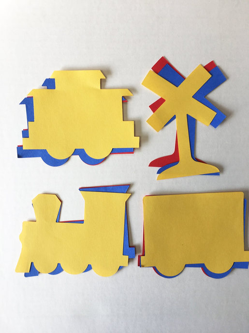 Four yellow puzzle-piece cut-outs with blue edges and red accent blocks