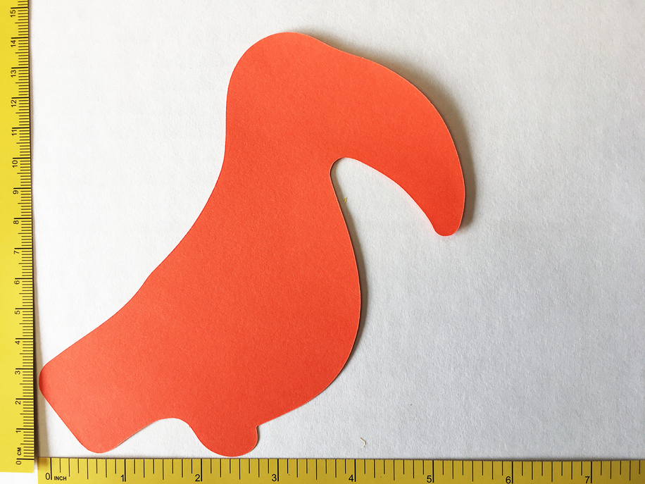 Orange bird cut-out shape next to a measuring ruler, simple flat design
