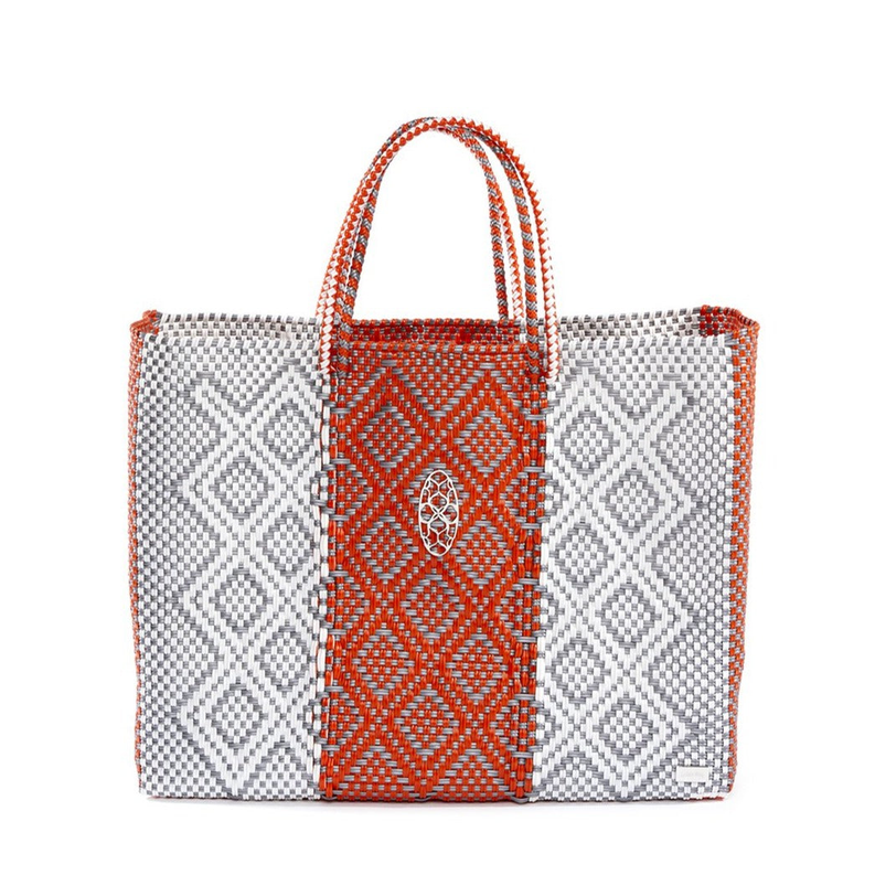 Woven orange-and-white travel tote with diamond pattern and central emblem