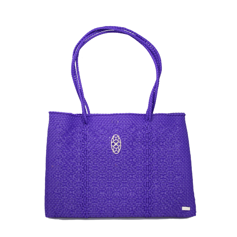 Purple woven travel tote with oval logo emblem, structured handles