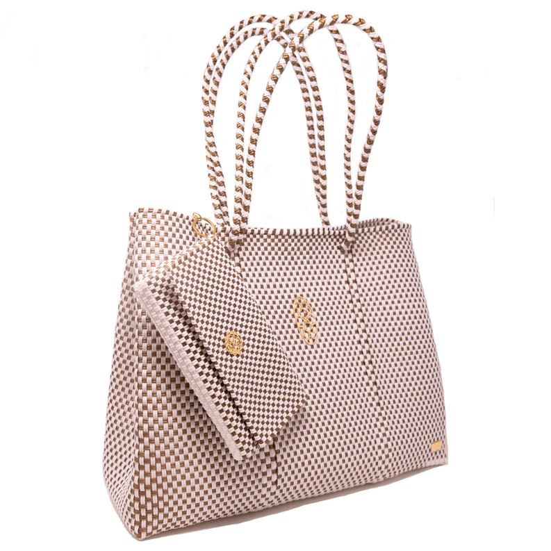 Woven beige travel tote with braided handles and small gold emblem