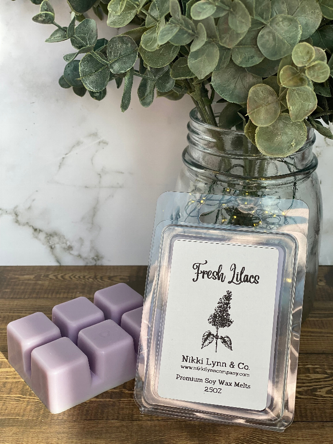 Fresh Lilacs wax melt cubes with lavender color and Nikki Lynn & Co clamshell label