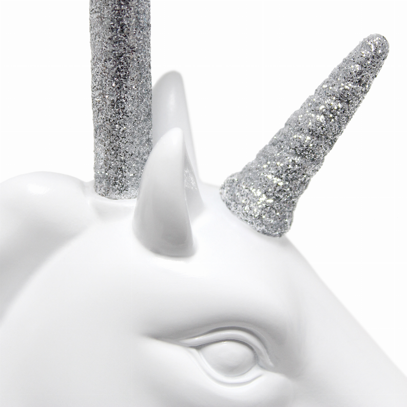 Unicorn table lamp close-up of white base with silver glitter horn and spout-like details