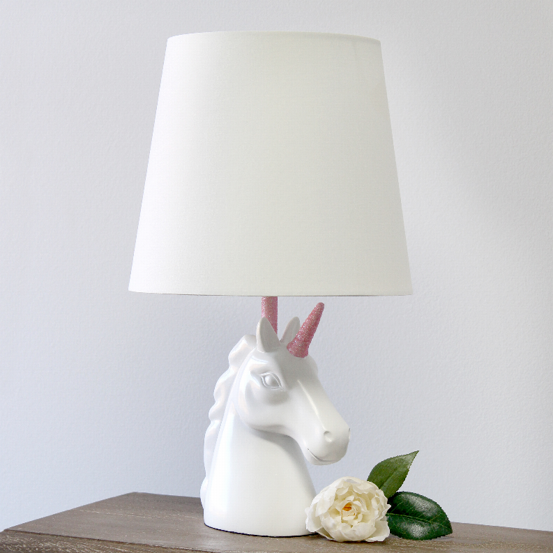 White unicorn table lamp with pink glitter horn and white fabric shade