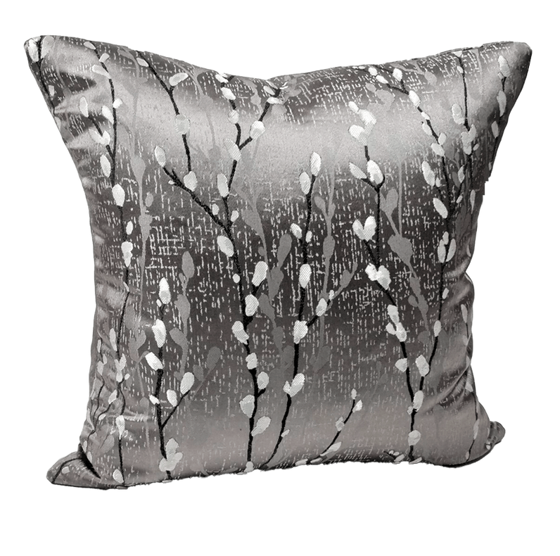 Gray throw pillow cover with white speckled branch pattern and stitched piping edge.