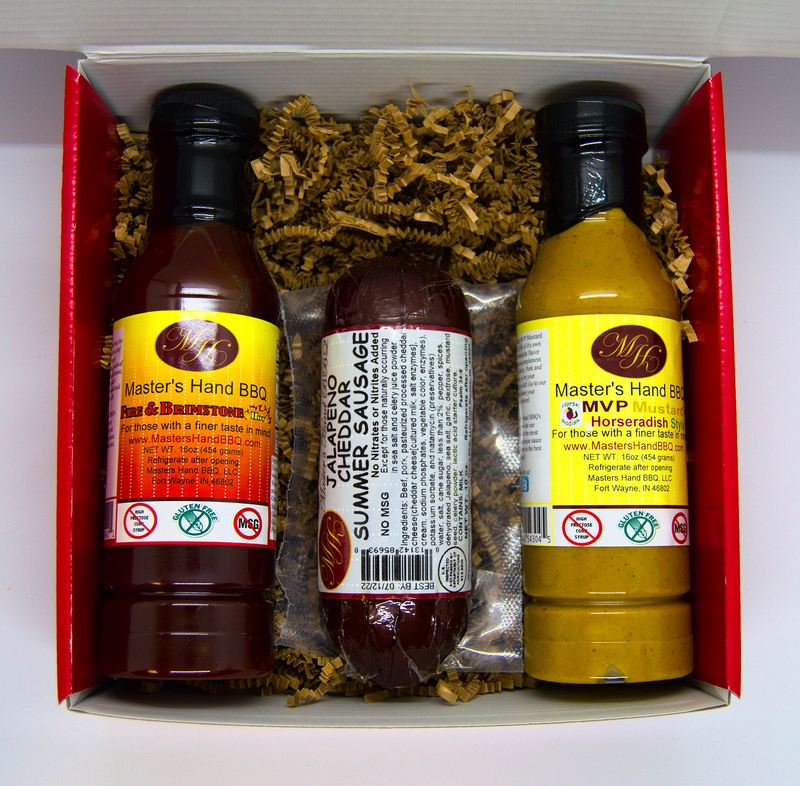 Seasoning gift set with two bottles and a sausage pack in a red box