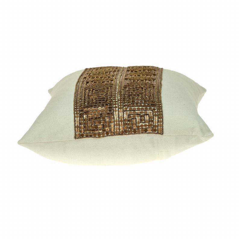 Lumbar throw pillow with light sage cover and centered gold-brown geometric beadwork band