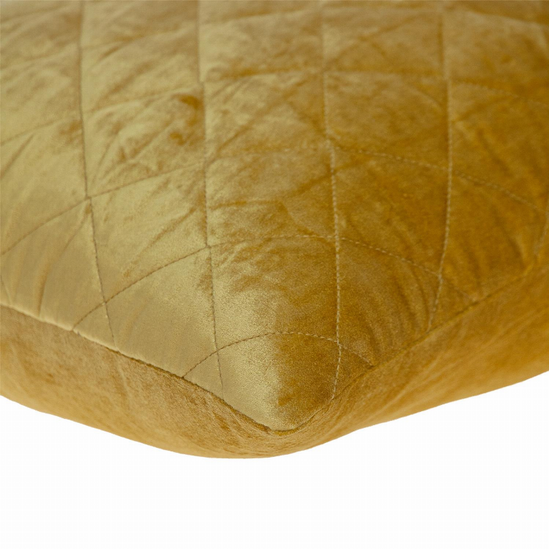 Yellow quilted throw pillow corner with diamond stitching and soft textured fabric