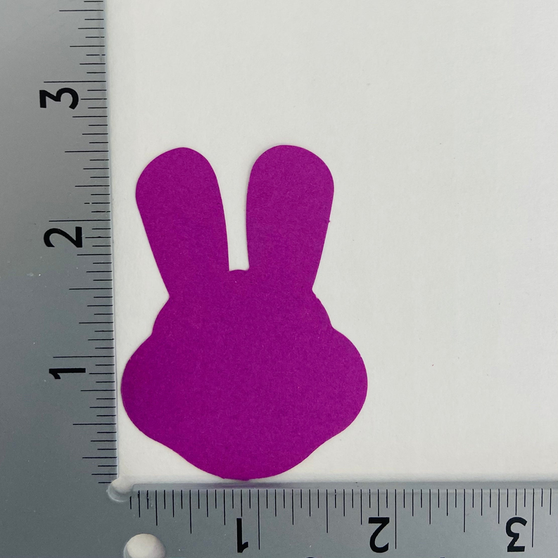 Purple bunny cut-out with upright ears and rounded body, felt-like silhouette