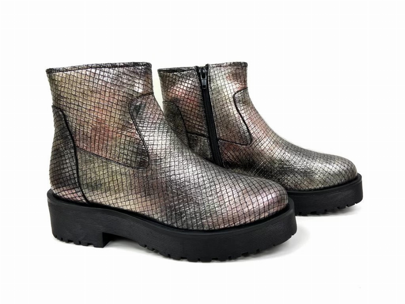 Pair of metallic silver ankle booties with side zipper and textured finish