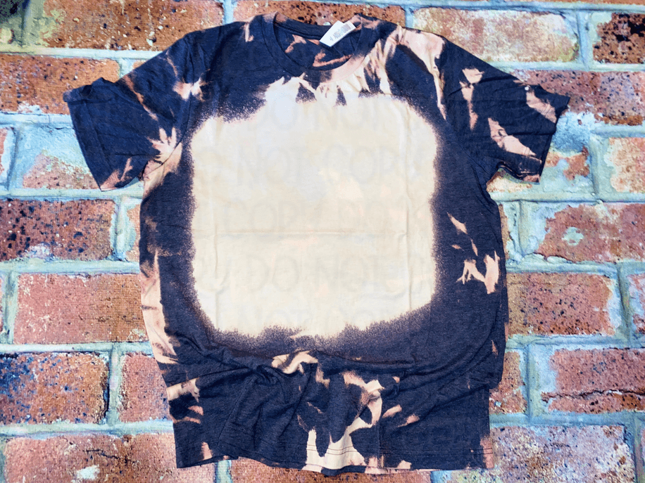 Navy bleach-splatter T-shirt with crew neck, short sleeves, large oval center stain, knotted hem
