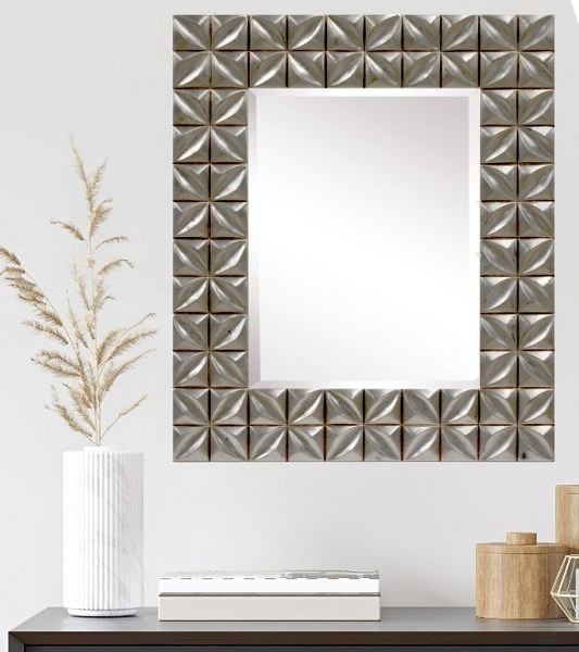 Silver square decorative wall mirror with textured geometric tile border.