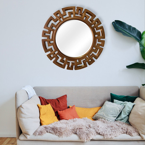 Bronze round wall mirror with decorative Greek-key frame and clear glass center