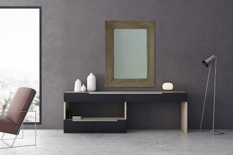 Rectangular wall mirror with dark wood frame on cabinet in modern room