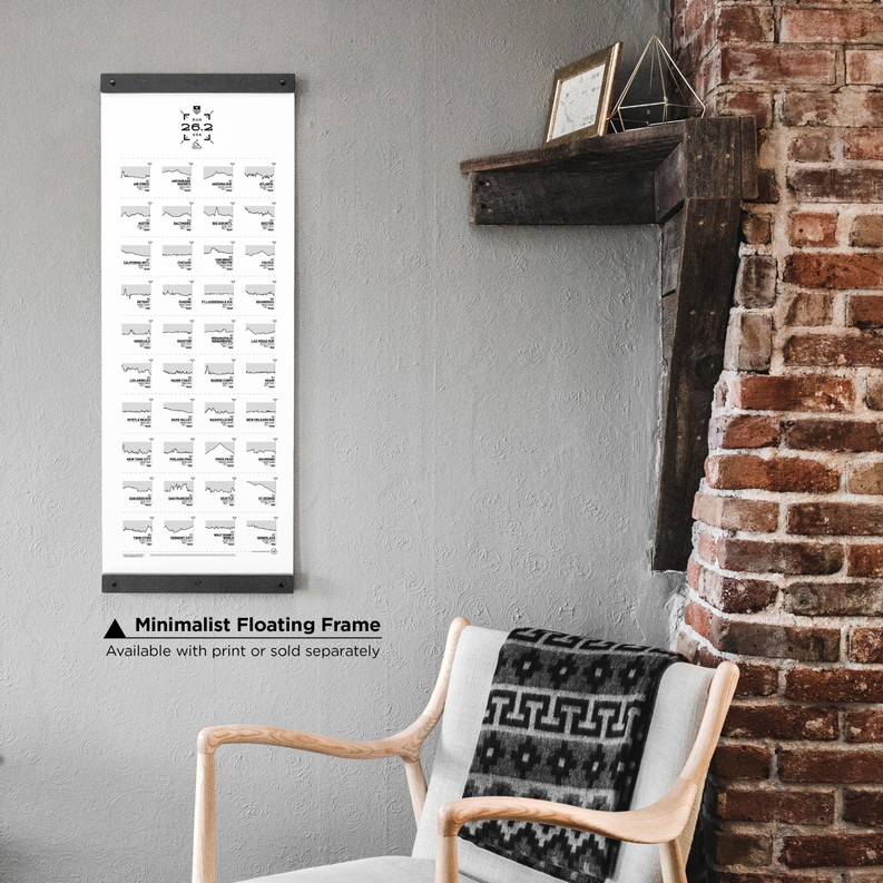 Marathon register print in minimalist floating frame on wall with chair in foreground