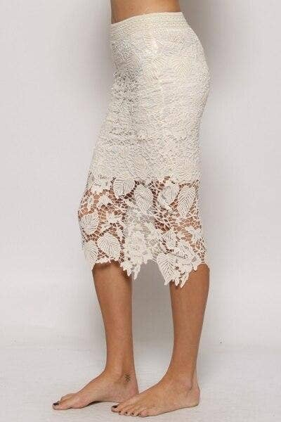 Off-white lace midi pencil skirt, fitted silhouette with floral scalloped lace hem.