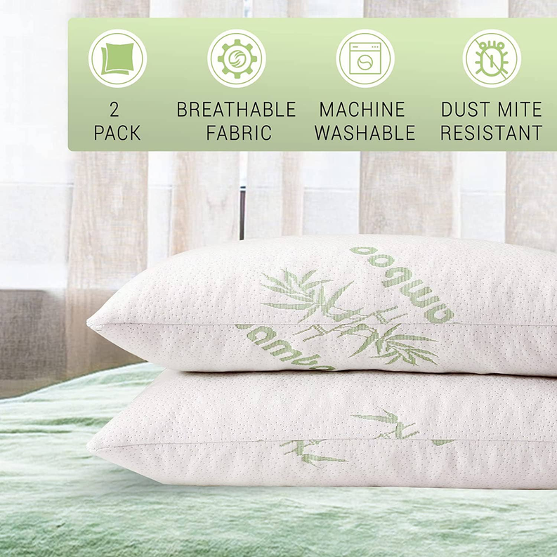 Two support pillows with white bamboo-printed covers, stacked on bedding.