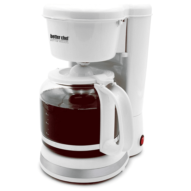 White coffee maker with swing-out filter and glass carafe filled for brewing
