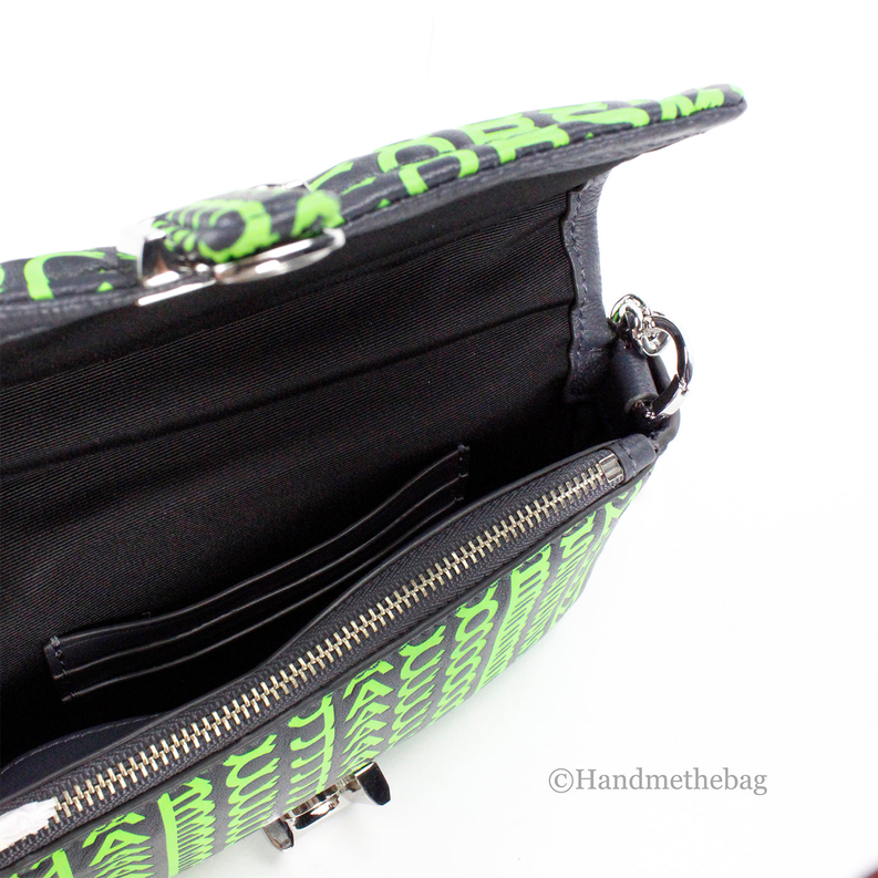 Green mini shoulder bag close-up: black interior, zipper pocket, silver hardware
