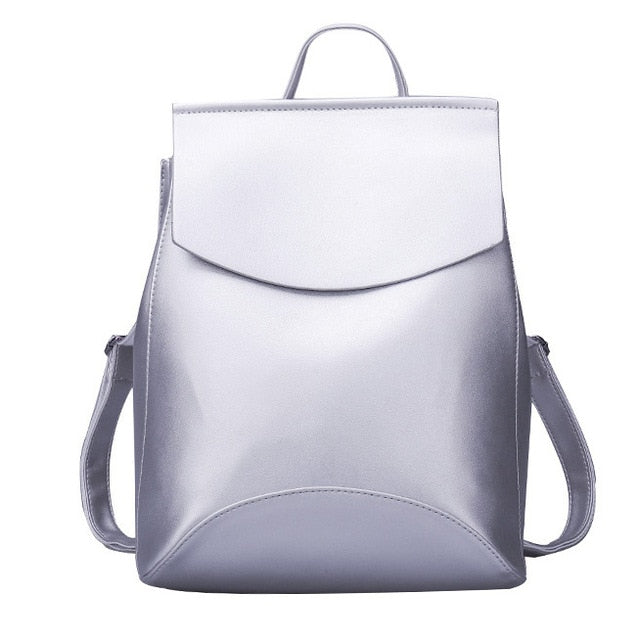 Light gray leather backpack with front flap pocket and side shoulder straps