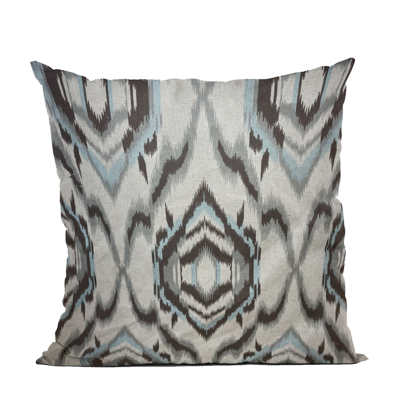 Handmade luxury ikat throw pillow in cream, light blue, and dark gray geometric design