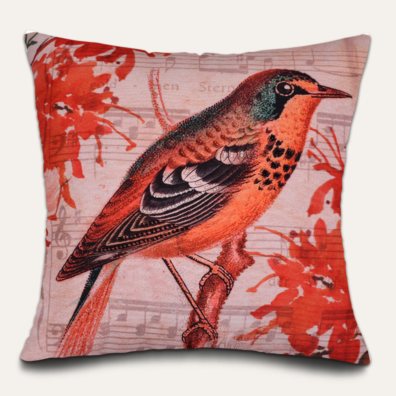 Bird-pattern pillow cover close-up, red orange bird on beige with leaf motifs