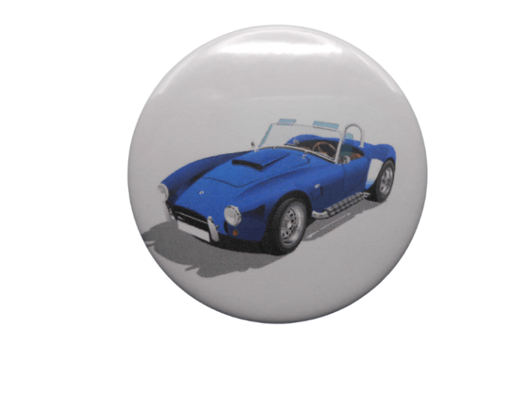 2.25 inch round car badge with blue classic sports car and chrome grille