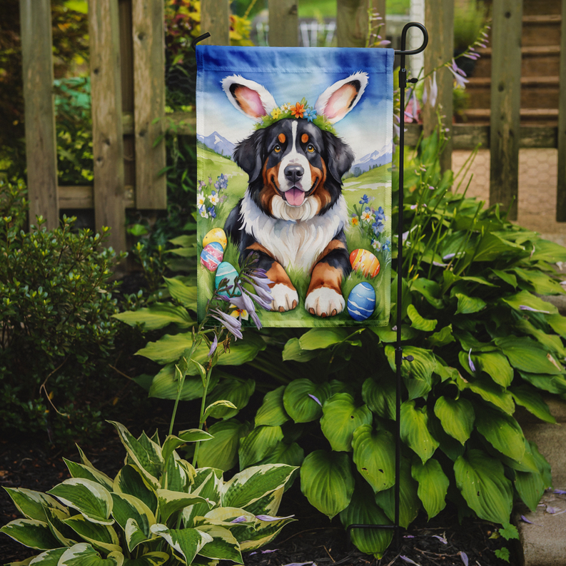 Easter garden flag with Bernese mountain dog lying in grass with Easter eggs on stake
