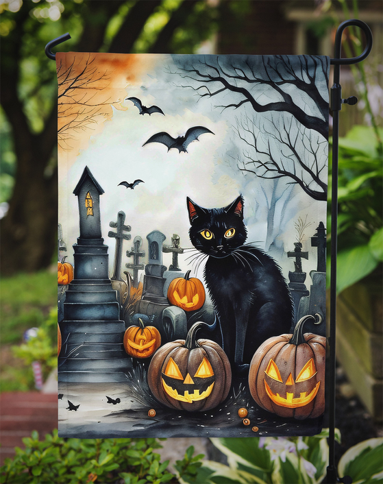 Halloween garden flag featuring black cat, bats, graveyard tombstones, and orange pumpkins