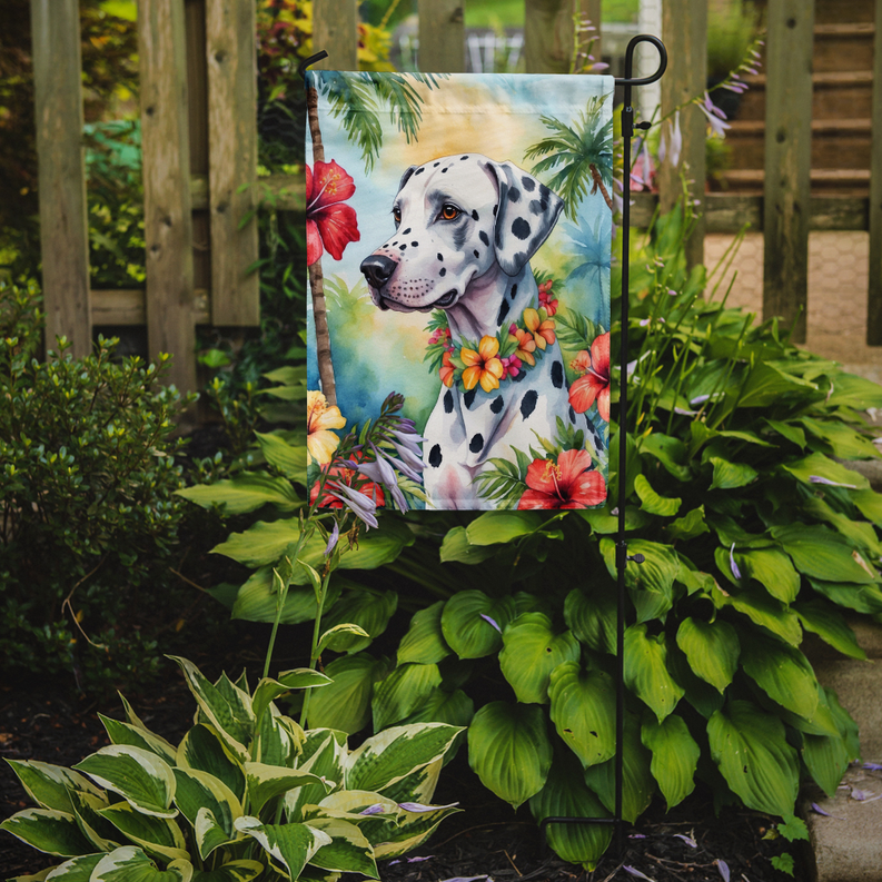 Dalmatian garden flag on a stake with tropical flowers and ocean background