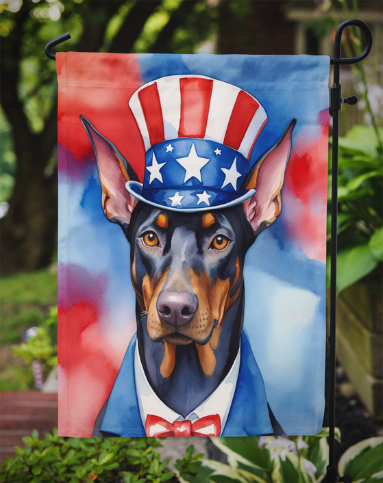 Patriotic Doberman garden flag with Uncle Sam hat, bow tie, and red white blue watercolor design
