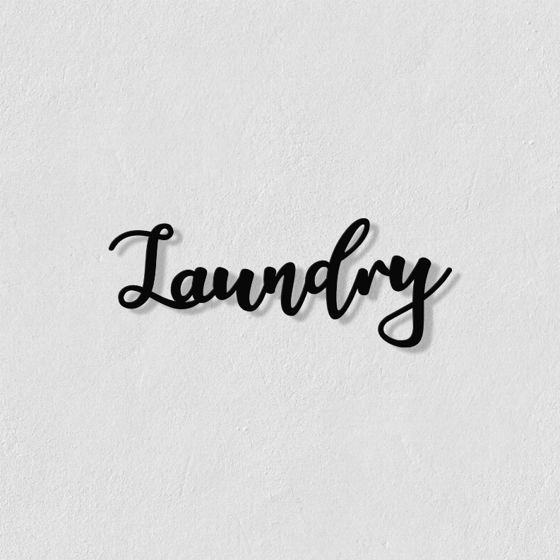 Laundry metal wall art close-up, cursive black 'Laundry' word sign