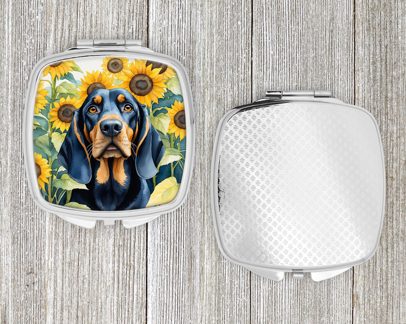 Silver compact mirror with hinged open cover and blue dog in sunflower artwork