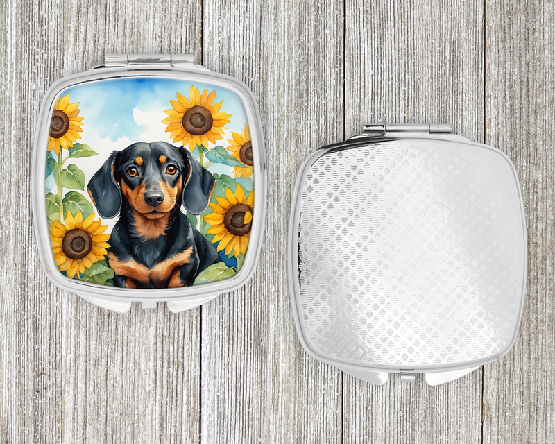 Sunflower compact mirror with black and tan dog graphic, inside view