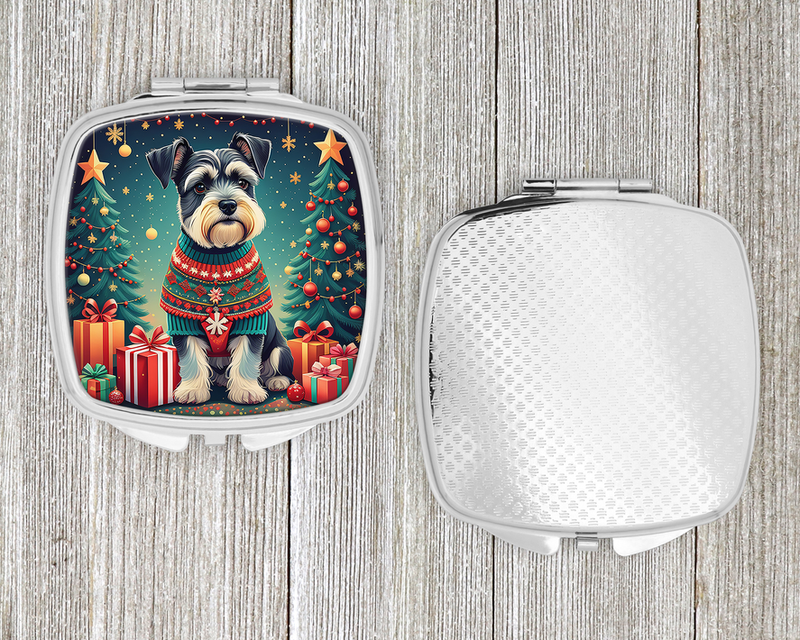 Silver compact mirror case showing Christmas schnauzer front lid and plain textured back
