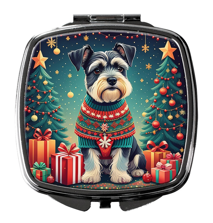 Silver compact mirror with closed lid featuring a Christmas schnauzer in sweater and gifts